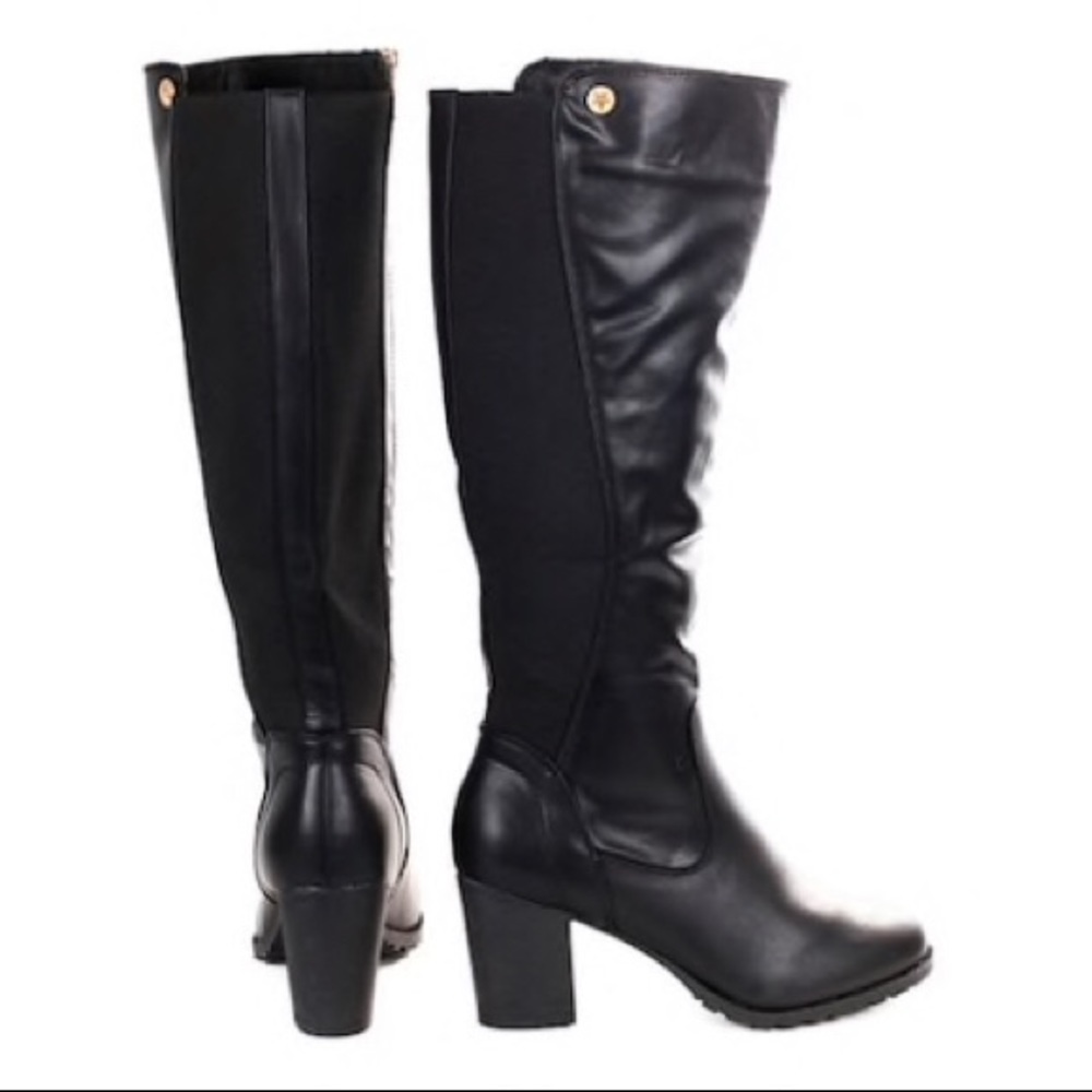 Knee high black heeled boots. Worn once
